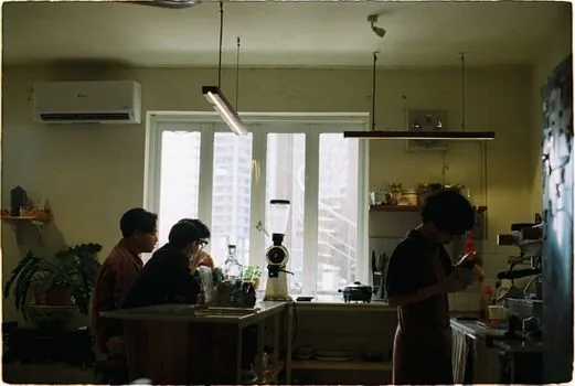 interior of a small korean storefront in the early morning, warm cozy atmosphere, counter and shelves, no people, wide editorial photography, natural light