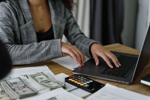 business owner checking payroll spreadsheet