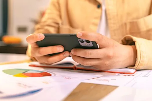 business owner checking tax agent registration status on smartphone