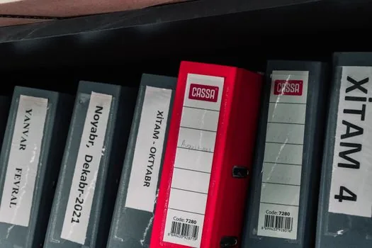 employee contract and payroll records stored in labeled archive folders