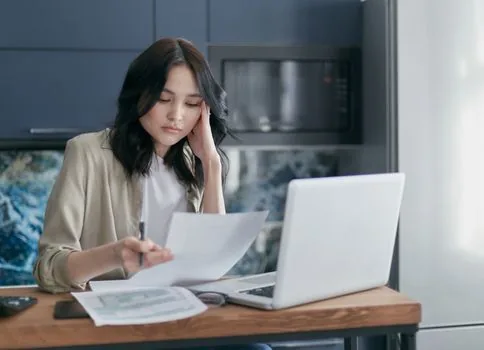 Korean freelancer checking tax deadline calendar and income documents