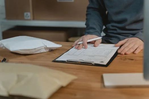 Korean industrial supplier office with delivery schedule documents and safety checklist