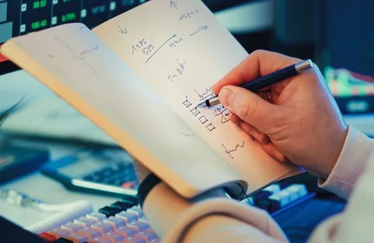 office desk with payslip form and attendance record