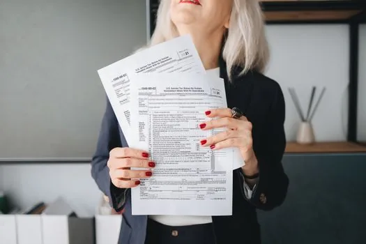 organized business tax documents folder and PDF files