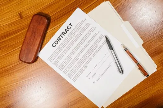 small shop hiring checklist with employment contract, payroll note and phone calendar, editorial documentary photo