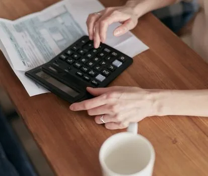 tax calendar marked February 10 with invoice summary and calculator