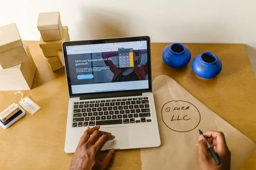 Business registration certificate, home office lease note, tax checklist, laptop, and online store parcels arranged for Korean ecommerce startup