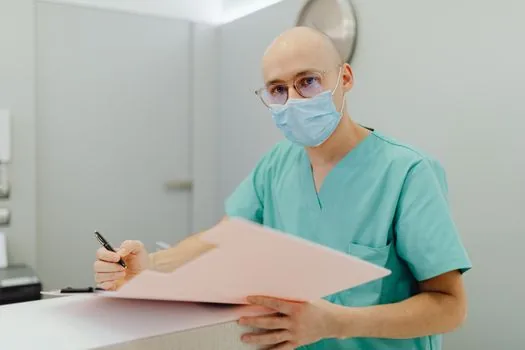 caregiver writing dementia resident observation log beside hallway movement map, realistic Korean care facility scene