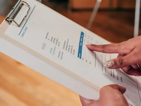 corporate seal card and company document checklist next to bank account opening appointment memo, realistic Korean office photo