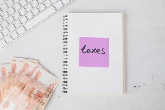 Korean business owner saving tax notice PDF with filename and payment memo on laptop, realistic desk photo | 중간예납 고지서와 납부 메모를 파일로 정리하는 장면