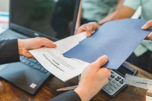 Korean real estate exchange contract with apartment documents and tax calculator on office desk, realistic editorial photo