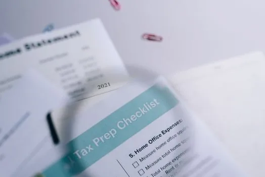 Korean small company grant application folder with social insurance certificate, tax certificate, and checklist arranged on desk, realistic editorial photo, no readable personal data
