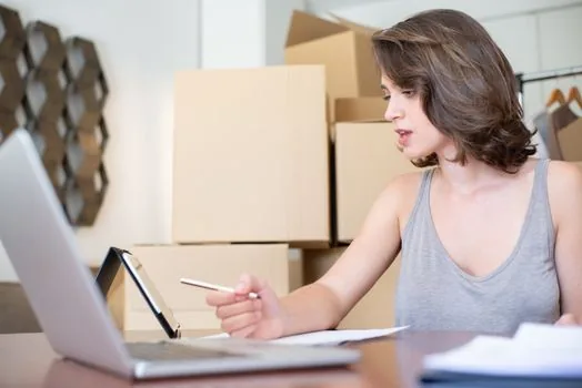 online store owner preparing government change report with laptop, business certificate, ecommerce dashboard, and checklist | 통신판매업 변경신고와 온라인몰 판매자 정보를 함께 확인하는 장면