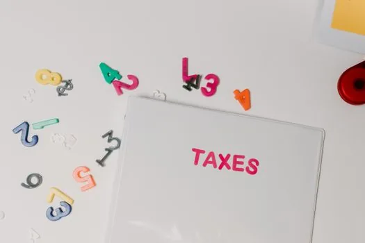 Real estate sale contract, calculator, and Korean tax checklist showing 30 billion won threshold concept without exact private data