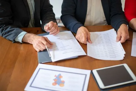 business contract review desk with data privacy checklist and AI vendor policy documents