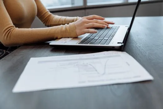 business owner selecting tax certificate type and period on laptop with printed funding checklist, realistic Korean office photo | 정책자금 제출 전 홈택스 증명서 종류와 기간을 고르는 장면