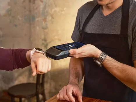 Korean shop owner checking mobile identity verification for QR payment merchant application beside business registration certificate | 제로페이 신청 전 대표자 본인인증과 사업자등록증을 확인하는 장면