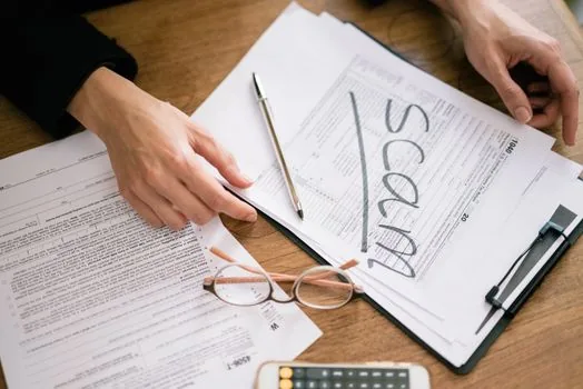 Korean shop owner filing card fee refund statement, bank account printout and tax folder, realistic small office documentation photo | 카드수수료 환급 조회 화면과 통장 입금내역을 보관하는 장면