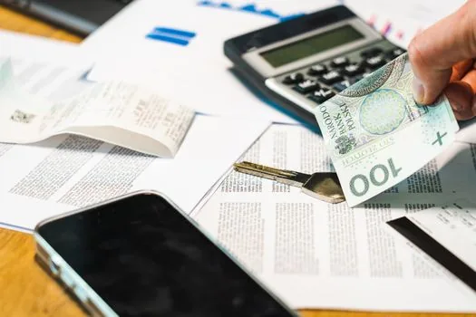 Korean small business owner checking paper tax notice, smartphone alert and Hometax screen on desk, realistic bright office photo | 종이 고지서와 홈택스 전자고지 알림을 함께 확인하는 장면