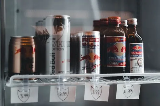 Store owner photographing nameplate and energy label on installed commercial refrigerator, realistic documentary photo | 매장 냉장고 설치 뒤 명판과 에너지효율 라벨을 촬영하는 장면